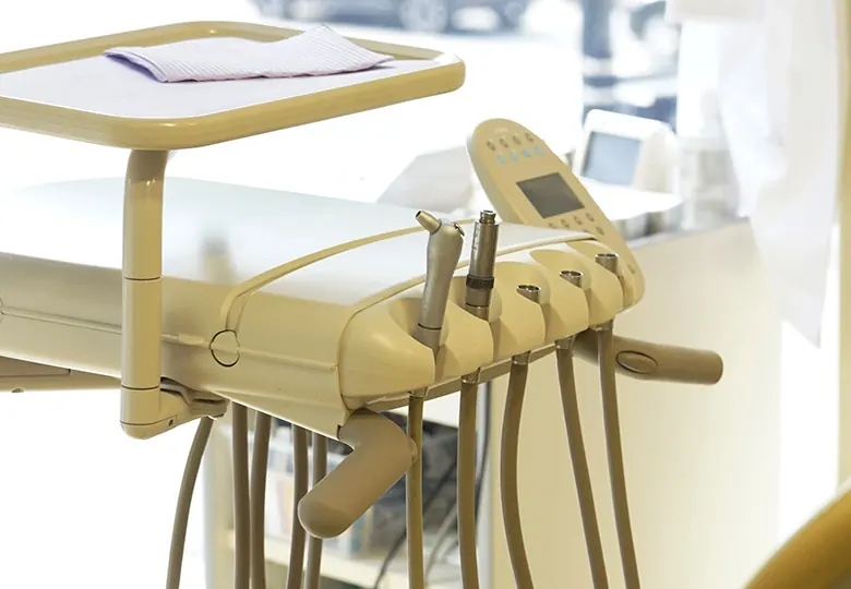 Dental instruments on the delivery unit in a Davidson Dental Associates treatment room.
